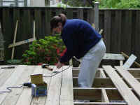 jenn installing planks.JPG (146778 bytes)