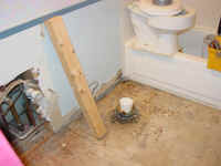 ripping up toilet.JPG (799447 bytes)